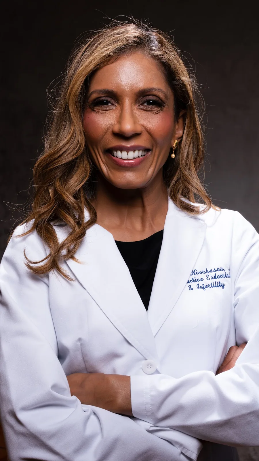 Dr. Noorhasan in her white coat